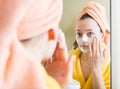 Girl applying cream on skin Royalty Free Stock Photo