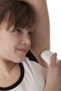 Girl applying deodorant on armpit Royalty Free Stock Photo