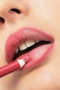 Girl applying lip liner Royalty Free Stock Photo