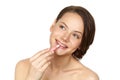 Girl applying lipgloss Royalty Free Stock Photo