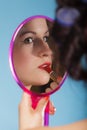 Girl applying make up red lipstick Royalty Free Stock Photo