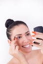 Girl applying makeup on eyebrows Royalty Free Stock Photo