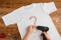 Girl applying rhinestones to t-shirt Royalty Free Stock Photo