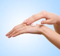 Girl applying some white lotion on her hand Royalty Free Stock Photo