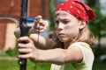 Girl archer with bow shooting Royalty Free Stock Photo