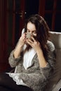 Girl armchair drinking tea from big cup Royalty Free Stock Photo