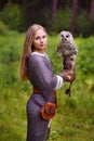 Girl in armor holding an owl