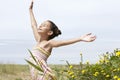 Girl With Arms Outstretched Enjoying Sunlight At Field Royalty Free Stock Photo