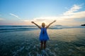 Girl with arms wide open at beach sunset Royalty Free Stock Photo