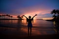 Girl with arms wide open at beach sunset Royalty Free Stock Photo