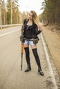 Girl assassin waiting for his victim on the road. Royalty Free Stock Photo