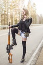 Girl assassin waiting for his victim on the road. Royalty Free Stock Photo