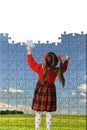 The girl assemble big puzzle Royalty Free Stock Photo