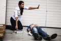 Girl assisting an unconscious man