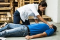 Girl assisting an unconscious man Royalty Free Stock Photo