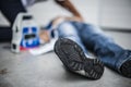 Girl assisting an unconscious man Royalty Free Stock Photo