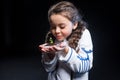 Girl astronaut holding plant