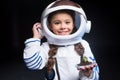 Girl astronaut holding plant