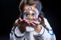 Girl astronaut holding plant