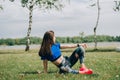 Girl athlete does squats in nature exercises for the buttocks. Young woman go in for sports healthy lifestyle athletic body.
