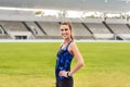 Girl, athlete and happy portrait in stadium for long distance running or sprinting for athletics and training. Female Royalty Free Stock Photo