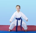 Girl athlete stands in rack of karate