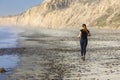 Girl in Athletic Clothing Jogging on Torrey Pines State Beach San Diego California Royalty Free Stock Photo