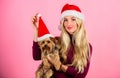 Girl attractive blonde hold dog pet pink background. Celebrate christmas with pets. Reason love christmas with pets Royalty Free Stock Photo