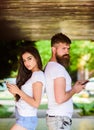 Girl attractive brunette bearded hipster man stand back to back porch underground crossing. Couple ignore real Royalty Free Stock Photo