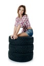 Girl with automobile tyres Royalty Free Stock Photo