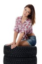 The girl with automobile tyres Royalty Free Stock Photo