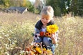 Girl with autumn flowers