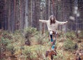 Girl in the autumn forest shaman conducts ritual