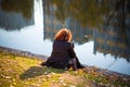 girl in autumn park near the water Royalty Free Stock Photo