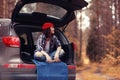 Girl at autumn trip by car