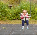 Girl. Baby. Cute. Smile. Swing. Park Royalty Free Stock Photo