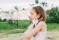 Girl with baby goat on farm outdoors. Love and care. Village animals. happy child hugs goat, concept of unity of nature Royalty Free Stock Photo