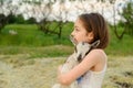 Girl with baby goat on farm outdoors. Village animals. happy child hugs goat, concept of unity of nature and man Royalty Free Stock Photo