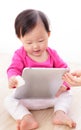 Girl baby happy play tablet PC Royalty Free Stock Photo