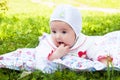 Girl baby a rattle played outdoors Royalty Free Stock Photo