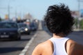 Girl from back, head and shoulders, on highway