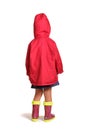 Girl is back in rubber boots and a raincoat isolated on white Royalty Free Stock Photo