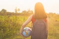 A girl with backback holding globe Royalty Free Stock Photo