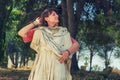 Girl in the background of an antique Roman statue on the ruins of Carthage, close-up portrait Royalty Free Stock Photo