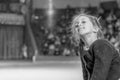 girl on the background of a big scene. A little girl dreams of performing on the big stage. black and white photo