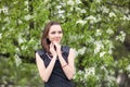 Girl on a background of a blossoming tree Royalty Free Stock Photo