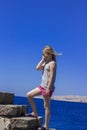 Girl on background of blue sky and sea