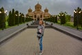 A girl in the background of the Church of St. Gregory the Illuminator in the center of Yerevan, May 2, 2019. Armenia. Royalty Free Stock Photo