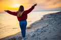 girl on background of the sea comes to a close