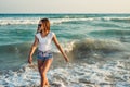 Girl on the background of the sea sunset